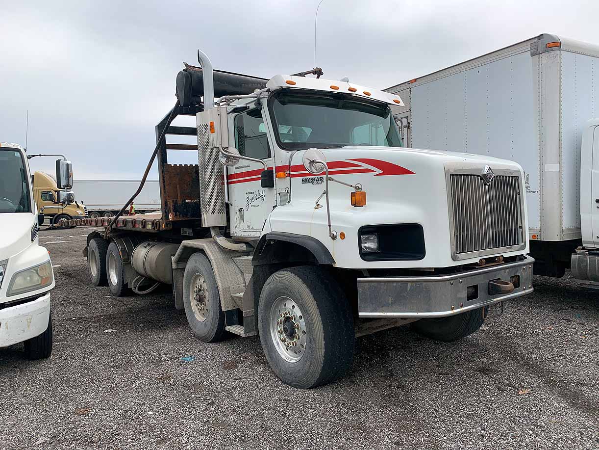 . International Paystar 5600i, 2007, CAT 15.2L, MT-AB, 8x4, Twin-Steer Roll-Off, 22.5ft Hoist, N#7943